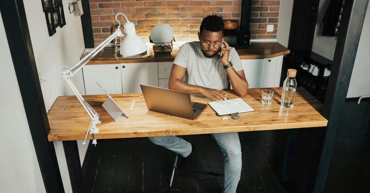 Man Working From Home Using Laptop